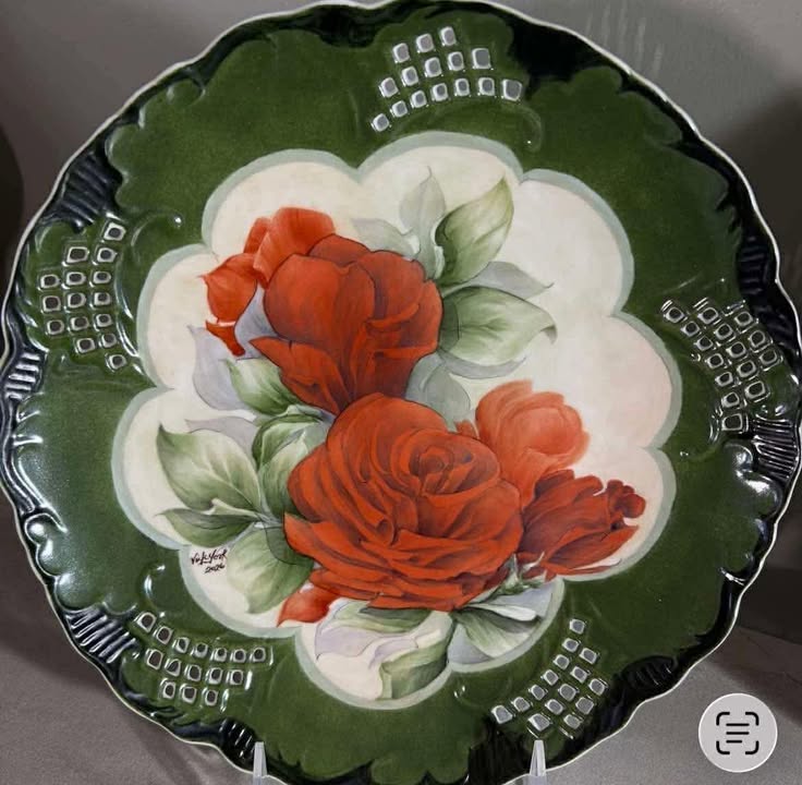 Lush red roses on a scrolled plate by Vicky York